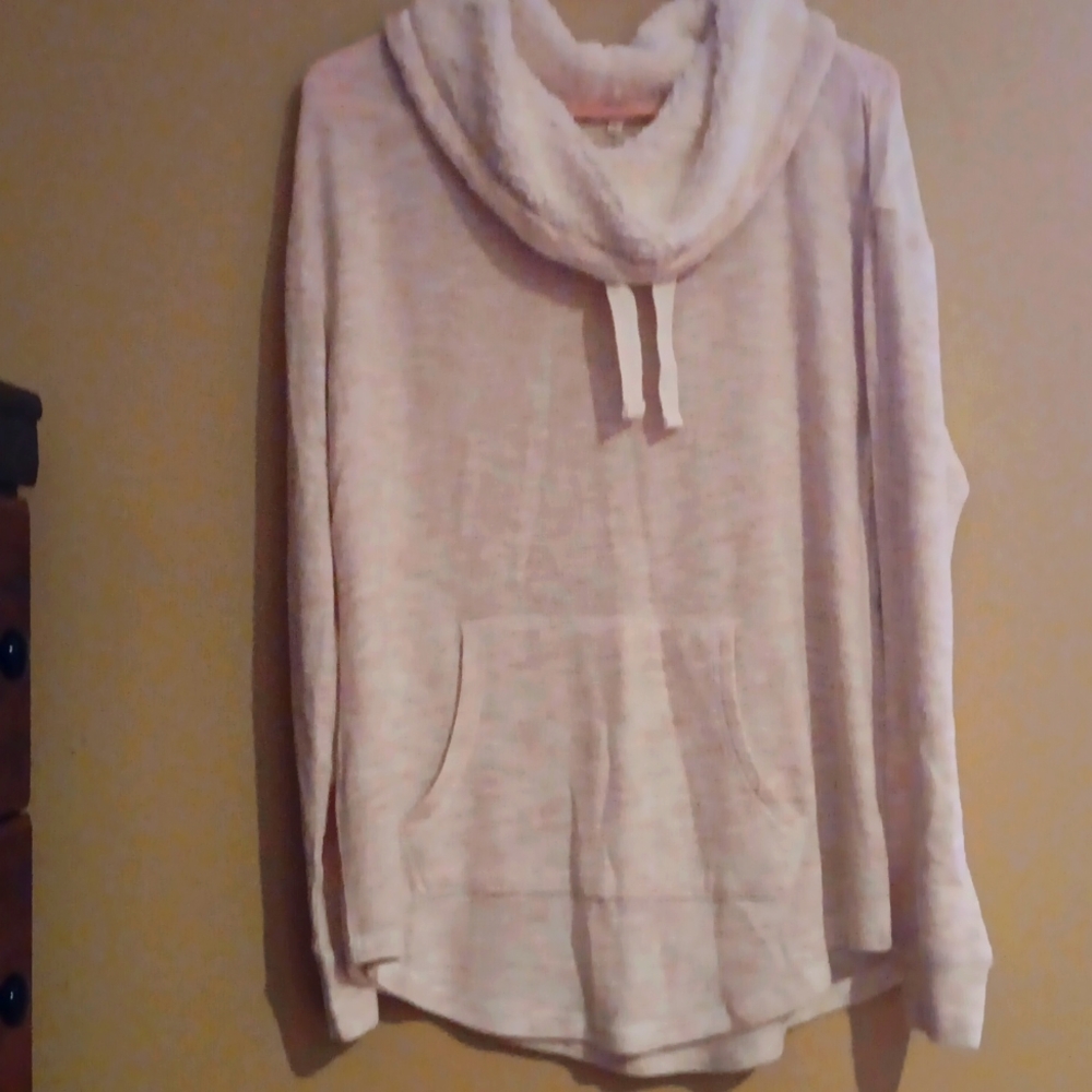 A tan funnel neck blouse